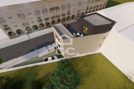 Land with approved project for a building with 3 apartments in the center of Avelar.