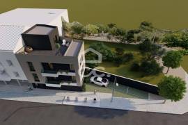 Land with approved project for a building with 3 apartments in the center of Avelar.