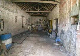 House and stone sheds with patio.