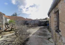 House and stone sheds with patio.