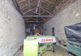 House and stone sheds with patio.