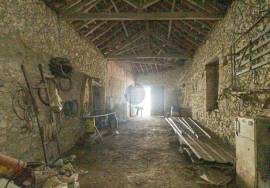 House and stone sheds with patio.