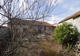 House and stone sheds with patio.