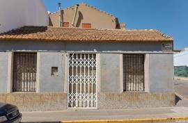 Two connected houses with separate entrances and different cadastral references