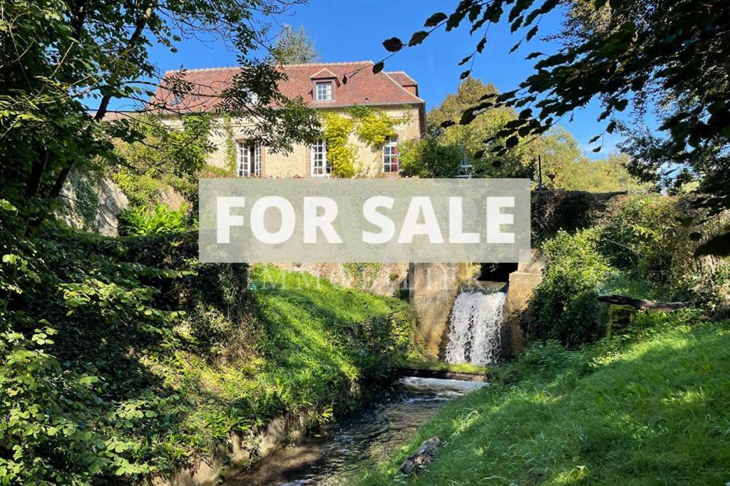 Former Water Mill with Waterfall and Body of Water