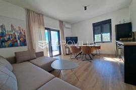 Lovran, modern furnished 60 m² apartment in a new building with a swimming pool.