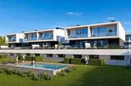 New 4 bedroom villa, with garden and terrace, in a private condominium with swimming pool.