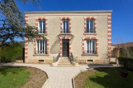 Elegant Village Residence with Two Additional Properteis, Outbuildings, and Enclosed Garden