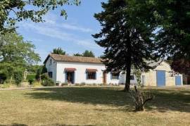 Charming Renovated Village Home with attached Barn and Landscaped Gardens