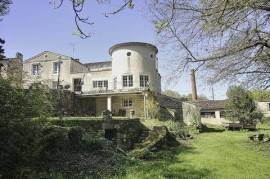 Exceptional four-bedroom residence with river and forest Views.