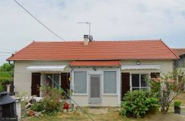 Beautifully Maintained Stone Bungalow with Spacious Garden and Outbuildings - €129,000