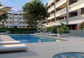 Modern apartments under construction in a gated condominium. Modern apartments under construction in a gated condominium.