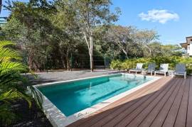 Villa Tropical Dawn: 4-Bedroom Modern Oasis in Bosques de Pinilla with Forest Views & Resort-Style Amenities